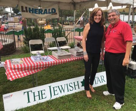 Rep. Kathleen Rice and South Shore Community Chest Executive Director Bob Block at The Jewish Star booth at Sunday's fair in Cedarhurst.