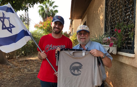 Harel and Rabbi Sidney Gold display their Cubs gear outside their home in Karnei Shomron.