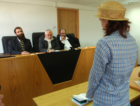 A women converts to Judaism in front of a three-judge beth din court in Jerusalem.