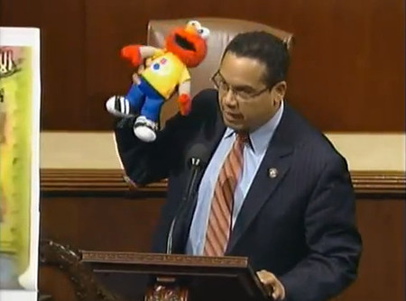Holding Elmo, Rep. Keith Ellison makes the case against defunding Palestinian Sesame Street, in 2012.