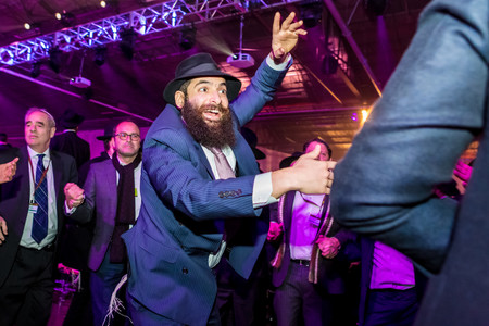 Rabbi Kussi Liepsker of Tuscaloosa, Alaba, dances with his colleagues at the Brooklyn banquet that climaxed last weekend&rsquo;s International Conference of Chabad-Lubavitch emissaries. The event drew 5,600 rabbis and guests from 90 countries.