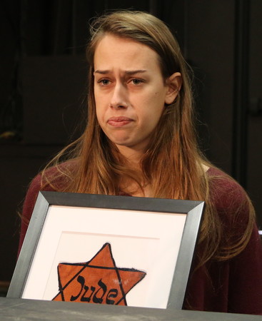 Wagner College student Sophia Spengler performs a monologue as Lodz ghetto survivor Dora Luba Malz. Dora&rsquo;s son Abraham Malz attended the play.