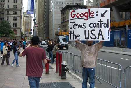 A man promotes an anti-Semitic conspiracy theory near the former World Trade Center site on Sept. 11, 2011, the 10th anniversary of the 9/11 attacks.