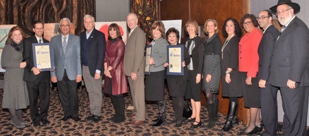 From left: Rabbi and Mrs. Aryeh and Elana Lebowitz (Community Service Award), Supervisor Anthony Santino, Councilman Bruce A. Blakeman, Esther Williams (President Shalom Task Force), Nassau County Legislator Howard Kopel, Aviva Hoch (accepting Legacy Award in memory of Gustave Jacobs, a&rdquo;h, her dad), Tina Machnikoff (Mental Health Services Award), Lois Raff Bieler (Legal Services Award), Nassau County Legislator Laura  Curran, Assemblymember Stacey Pheffer Amato, Queens County Clerk Commissioner of Jurors Audrey Pheffer, Liaison for NYC Controller Scott Stringer Pesach Osina, and Community Liaison for Rep. Grace Meng Daniel Pollack.