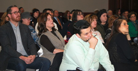 An audience made up predominently by members of the Orthodox community listens intently to a discussion on addiction, at the Woodmere firehouse on Dec. 14.