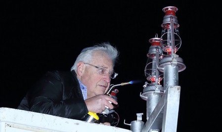 Ambassador designate David Friedman lights the Cedarhurst Park menorah on the second night of Chanukah.