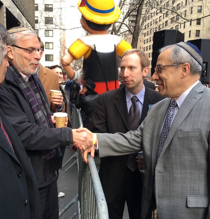 Rabbi Hershel Billet of the Young Israel of Woodmere greets Boro Park Assemblyman Dov Hikind at Thursday&rsquo;s protest outside the French mission to the U.N. in Midtown Manhattan as Avi Posnick of StandWithUs looks on.