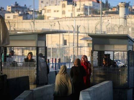 Palestinians cross the Qalandiya checkpoint, outside of Ramallah.