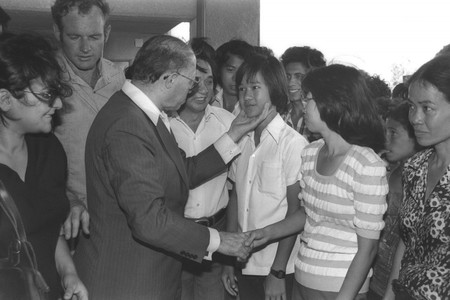 Prime Minister Menachem Begin greets Vietnamese refugees who were absorbed in Afula, June 26, 1980.