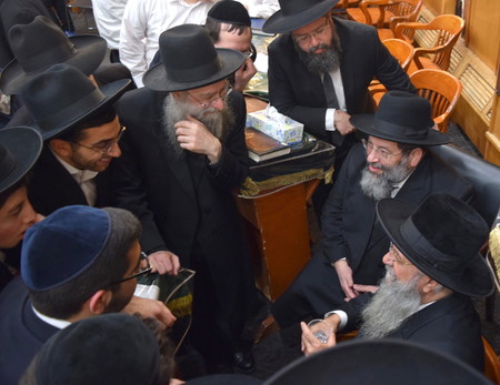 Pictured with Rav Hillel are Rav Shlomo Avigdor Altusky, center left; Rav Hillel&rsquo;s son; and Rav Yaakov Bender.