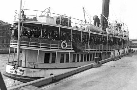 Immigrants arriving at Ellis Island aboard the tender Machigonne in 1923.