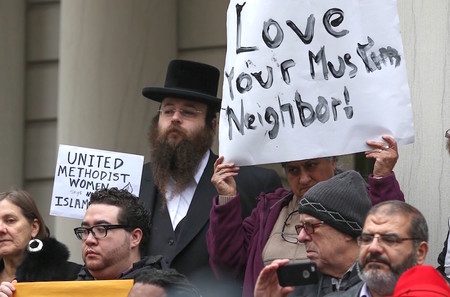 Alexander Rapaport, attending a protest at NY City Hall last December after candidate Donald Trump called for a ban on Muslims entering the U.S.
