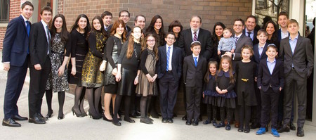 Rabbi Mordechai Besser with his children and grandchildren outside MDS on April 2, the day of the Upper West Side school's 74th Annual Scholarship Dinner.