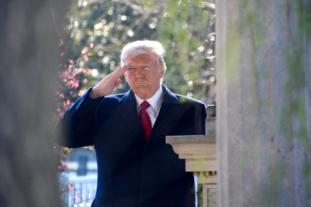 President Trump pays his respect at the grave site and renders a hand salute to former president Andrew Jackson.