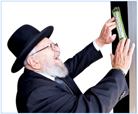 Rav Kamenetzky affixed a mizuzah at the 2015 grand opening of Gourmet Glatt in Woodmere. As the number of observant Jews grew, the number of kosher markets grew as well.