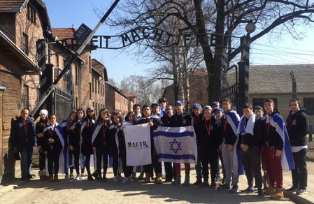 Students from HAFTR outside the main gate of the former Auschwitz extermination camp in Oswiecim, Poland, in May 2017.
