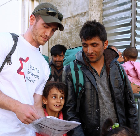 A volunteer with World Jewish Relief works with refugees in Greece.