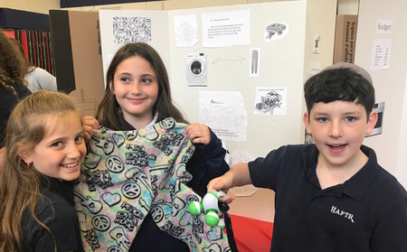 A pants prototype created by HAFTR fifth-graders (from left) Monica Fox, Sivan Laniado and Noah Popack.