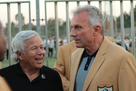 Former San Francisco 49ers quarterback Joe Montana, right, with New England Patriots owner Robert Kraft, drew the loudest applause when a group of football Hall of Famers was introduced in Ramat Hasharon, Israel, on June 15.