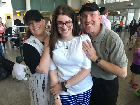 Gabriella Kate (center) couldn&rsquo;t contain her enthusiasm as she prepared to board Nefesh B&rsquo;Nefesh&rsquo;s Israel-bound El Al charter. Sending their daughter off, Gabriella&rsquo;s parents were filled with joy.