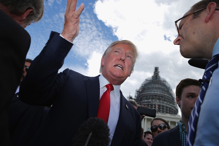 Candidate Donald Trump speaking with journalists at a rally against the Iran nuclear deal at the U.S. Capitol on Sept. 9, 2015