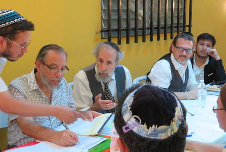 From left: Moshe Omar Cohen-Henriquez speaking with beit din members Rabbi Mark Kunis, Rabbi Andy Eichenholz and Rabbi Marc Phillipe in Managua, Nicaragua, on July 20. At far right is Even Centeno, a convert who traces his ancestry to Sephardi Jews who were forced to convert to Christianity.
