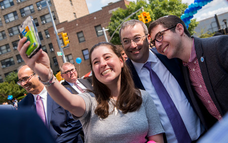 YU&rsquo;s new president, at the &ldquo;InvestFest&rdquo; street fair on Amsterdam Avenue after the investiture ceremony, was a sought-after celebrity who happily posed for a selfie.