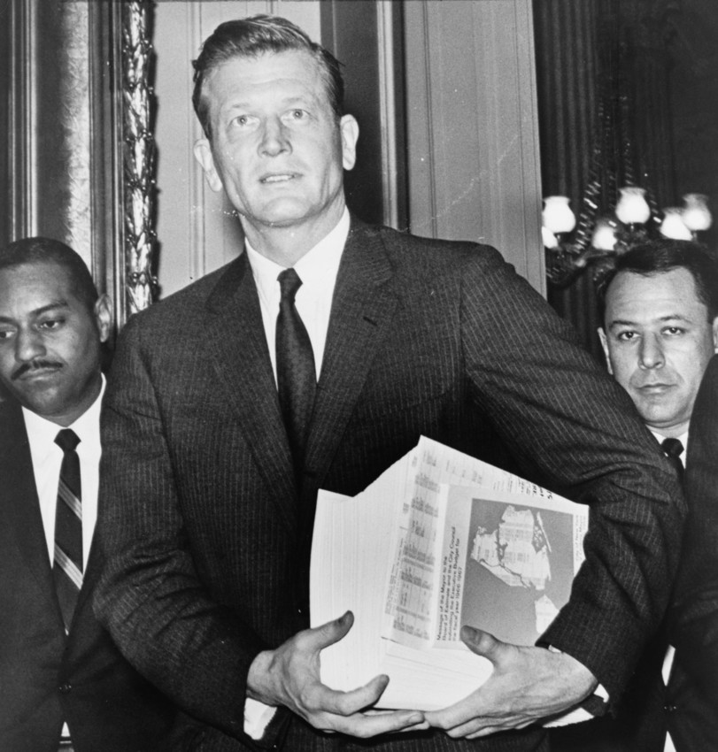 Mayor John Lindsay carries his budget in April 1966.