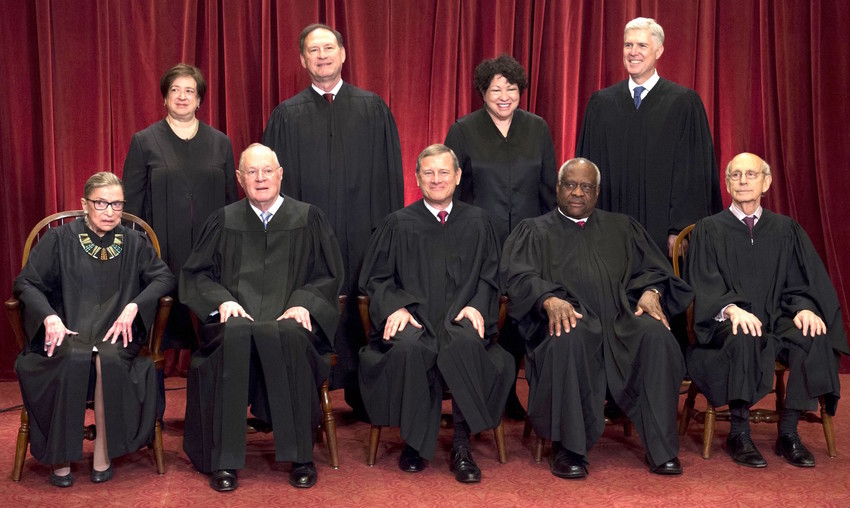 Justices of the US Supreme Court sit for their official group photo at the Supreme Court in Washington, DC, on June 1, 2017.   Seated (L-R): Associate Justices Ruth Bader Ginsburg and Anthony M. Kennedy, Chief Justice of the US John G. Roberts, Associate Justices Clarence Thomas and Stephen Breyer. Standing (L-R): Associate Justices Elena Kagan, Samuel Alito Jr., Sonia Sotomayor and Neil Grouch.