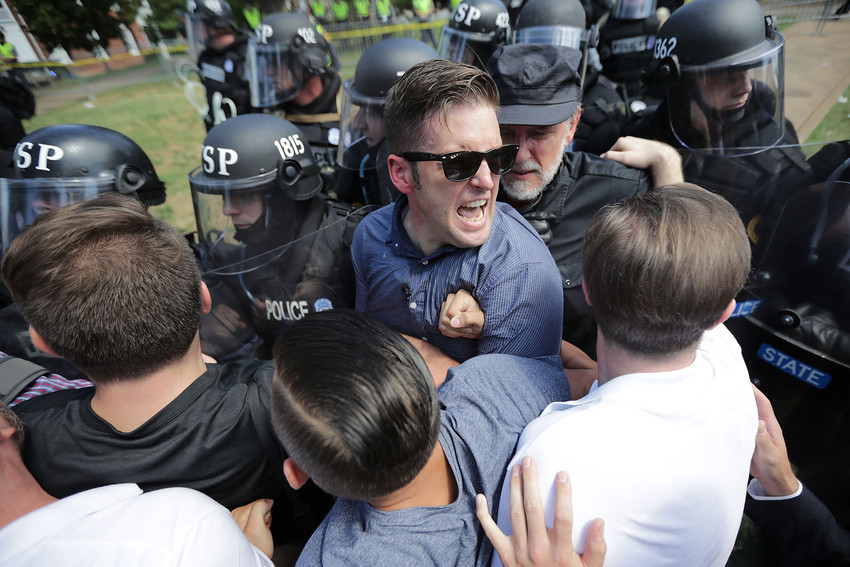 White nationalist Richard Spencer and his supporters clash with Virginia State Police in Emancipation Park after the &quot;Unite the Right&quot; rally was declared an unlawful gathering Aug. 12, 2017 in Charlottesville, Virginia.