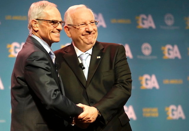 Israeli President Reuven Rivlin, right, shaking hands with Richard Sandler, board chairman of the Jewish Federations of North America, at the group&rsquo;s General Assembly in Los Angeles on Nov. 13.