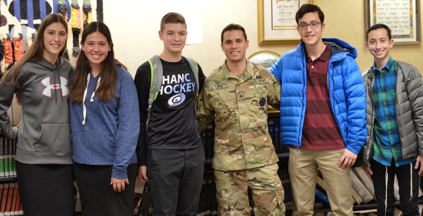Sgt. Jason Turk, HANC alumnus, visited on Veterans Day to brief students on his experience in the U.S. military, which included missions in Afghanistan and his current position as a National Guard recruiter.
