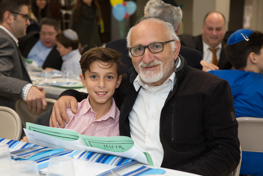At HAFTR's fifth grade boy's melave malkah chavruta learning program: Julian Isler and grandfather Reuven Mishiev.