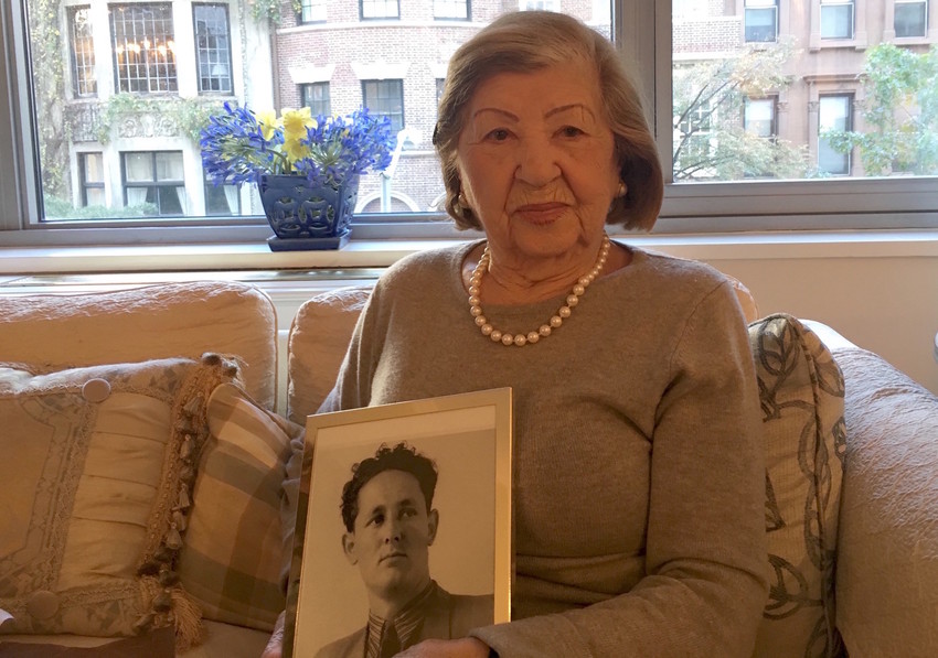 Rose Holm at her apartment holding a photo of her late husband, Joe, on Oct. 31.