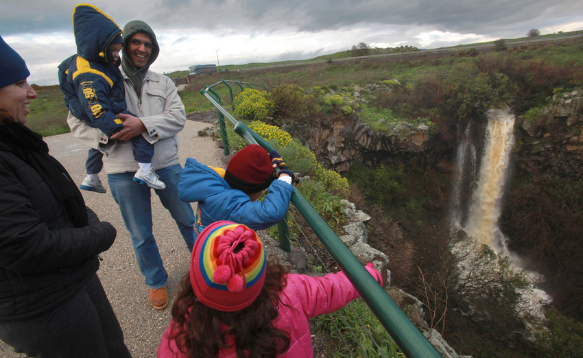 An Israeli family views Ayit Falls near the town of Katzrin on the Golan Heights.