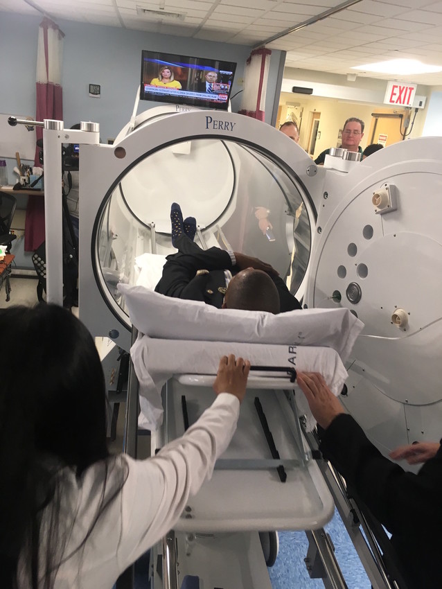 Far Rockaway state Senator James Sanders Jr. enters one of the new hyperbaric oxygen chambers.