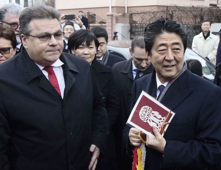 Japan's Prime Minister Shinzo Abe and Lithuanian Foreign Minister Linas Linkevicius arrive at the Sugihara House in Kaunas, Lithuania, on Jan. 14.