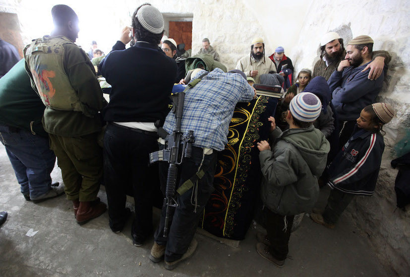 Jewish settlers praying in Joseph&rsquo;s Tomb in Nablus on Dec. 28, 2010.