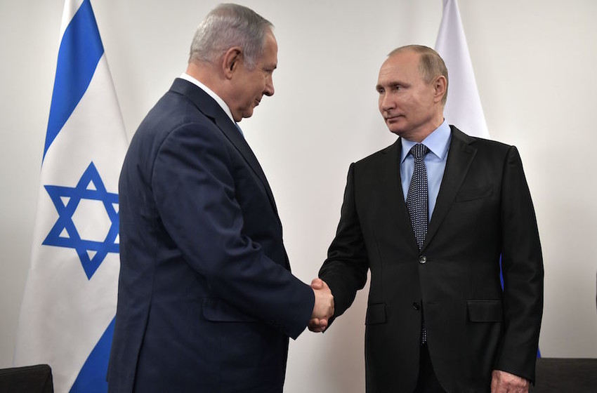 Russian President Vladimir Putin greets Israeli Prime Minister Benjamin Netanyahu at the Jewish Museum and Tolerance Center in Moscow, Jan. 29.