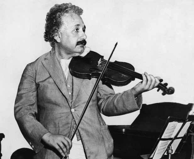 Albert Einstein playing a violin in 1931.
