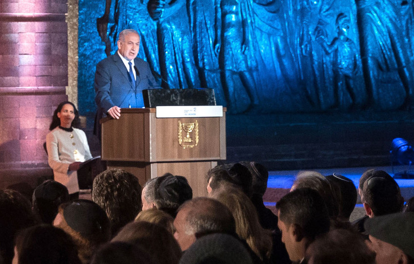 Israeli Prime Minister Benjamin Netanyahu speaks at the official state ceremony held at the Yad Vashem Holocaust Memorial Museum in Jerusalem, as Israel marked annual Holocaust Remembrance Day on April 11.