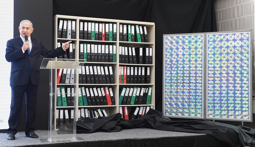 During his televised address on Monday, Israeli Prime Minister Benjamin Netanyahu points to shelves filled with secret files documenting Iran&rsquo;s nuclear weapons program.