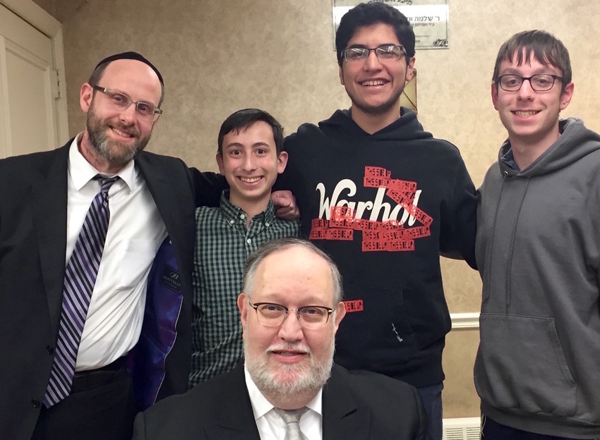 From left: Rabbi Shimon Chrein, Adam Speiser, Jonah Rocheeld, and Moshe Wieder. In front: Rabbi Mair Wolofsky, coordinator and founder of the Metropolitan Torah Bowl League in 1995.