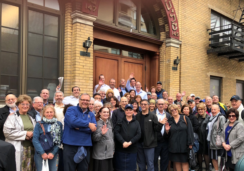 Young Israel of Woodmere members outside the Mesivta Tifereth Jerusalem shul during their walking tour of the Lower East Side.
