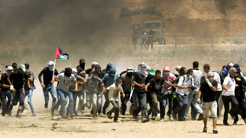 Palestinian protesters during clashes with Israeli forces along the border with the Gaza strip east of Gaza City on May 11.