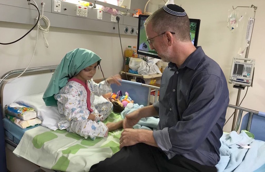 Dr. Morris Hartstein treating a Palestinian girl from Gaza with a lymphatic malformation in one of her eyes. She received treatment in an Israeli hospital.