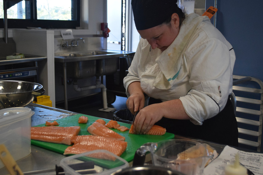 Chef Nina Vincenzina carved up a salmon in Kulanu Adademy&rsquo;s new commercial-grade kitchen.
