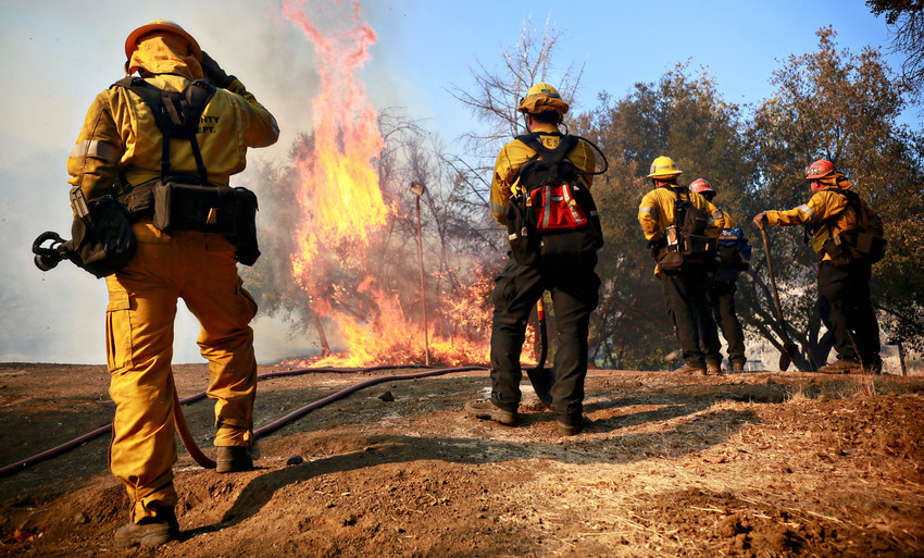 Firefighters battle a blaze at the Salvation Army Camp on Nov. in Malibu, California.