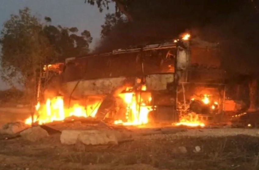 An Israeli bus traveling near the border with Gaza burns after being hit with Palestinian mortar fire on Monday. More than 450 rockets were fired into southern Israel from Gaza before a cease-fire took hold late on Tuesday.