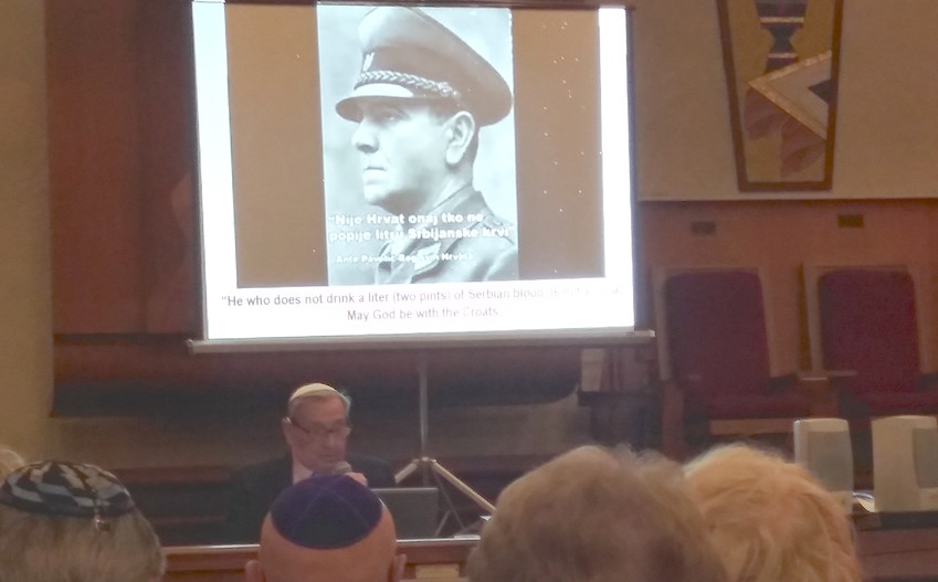 Werner Reich speaks at a Kristallnacht commemoration at the South Baldwin Jewish Center.